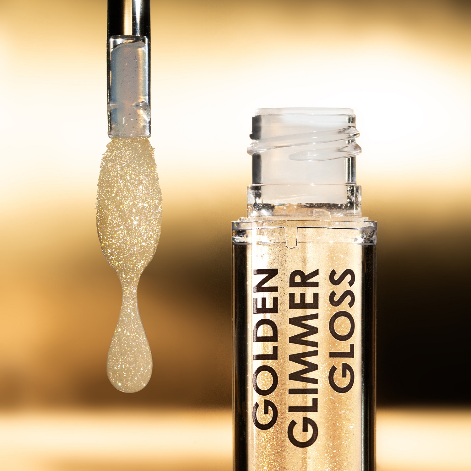 GOLDEN GLIMMER GLOSS SHIMMERING LIP-PLUMPER (GLOSS VOLUMINIZADOR PARA LABIOS)